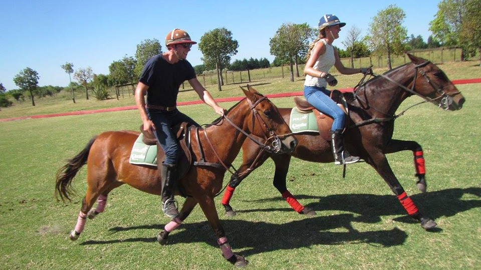 boy and girl riding a horse at estancia in argentina