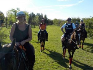 friends riding a horse at estancia in argentina