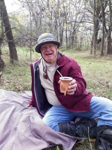 man smiling and holding a mate at estancia in argentina